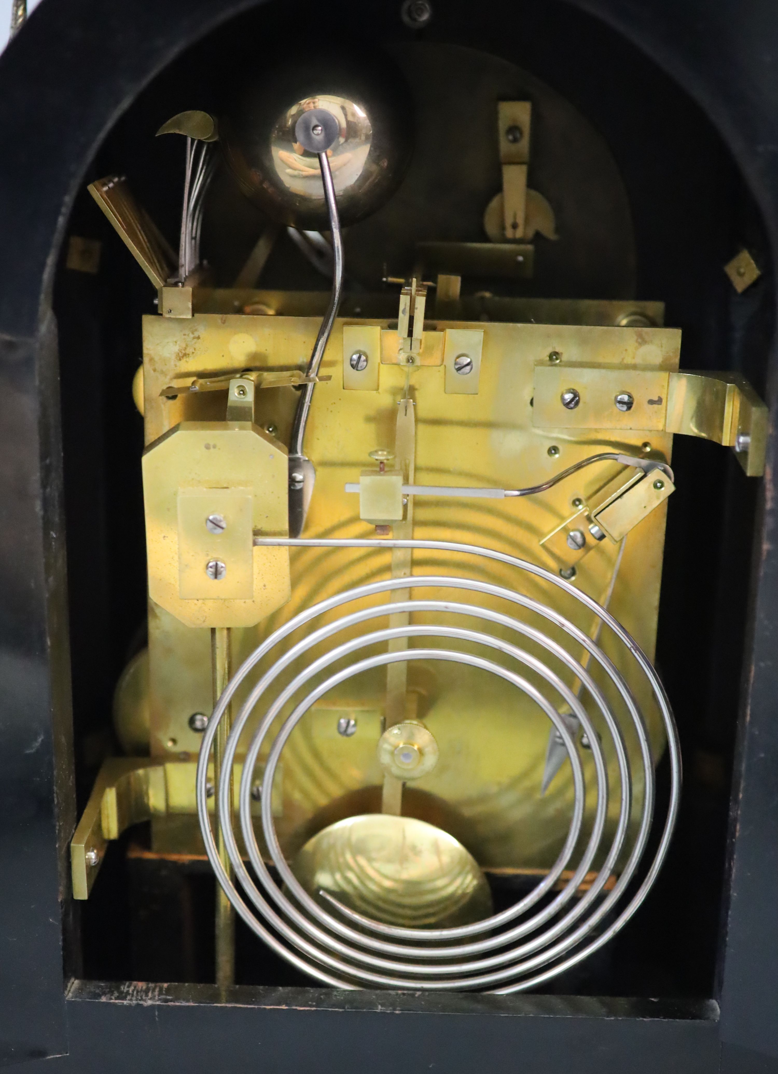 A large late Victorian ebonised bracket clock with bracket